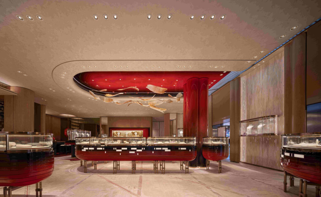 Inspired by the swaying bamboo favoured by Qeelin’s signature panda character, Bo Bo, curved timber walls wrap the central retail display area to create a warm and rhythmic setting for discovery.