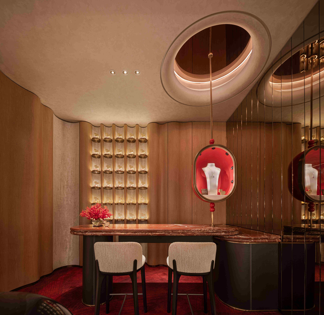 Under soft illumination, a wall of rounded vertical columns at the Perfume Bar continues the bamboo narrative, creating a warm, rhythmic backdrop to display the fragrance collection.